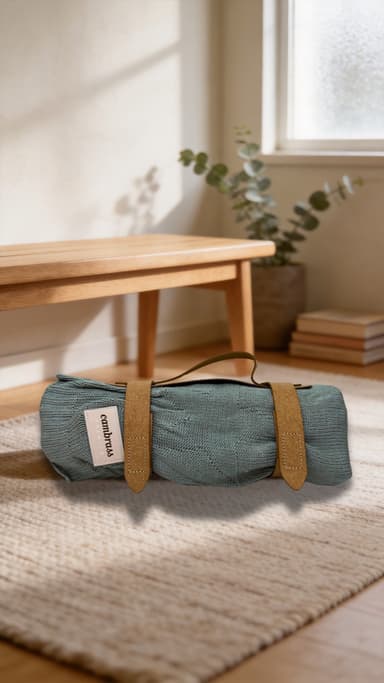 A Little Rei blanket rolled and strapped, packed ready to go by the door