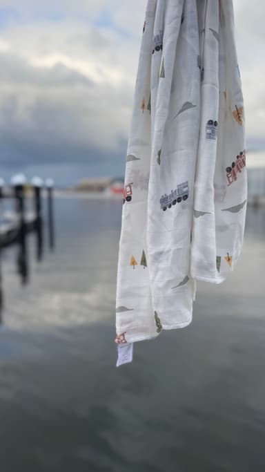 A bamboo muslin hanging in humid, overcast air above open water