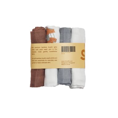 Four rolled bamboo muslin wash cloths in rust, carousel print, grey and white, held by a kraft band