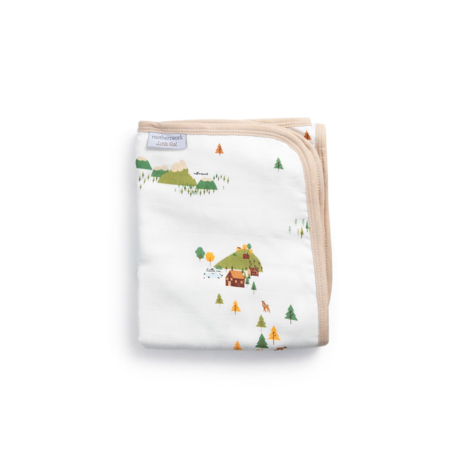 A folded bamboo blanket printed with a mountain and cabin scene, bound in sand-coloured trim