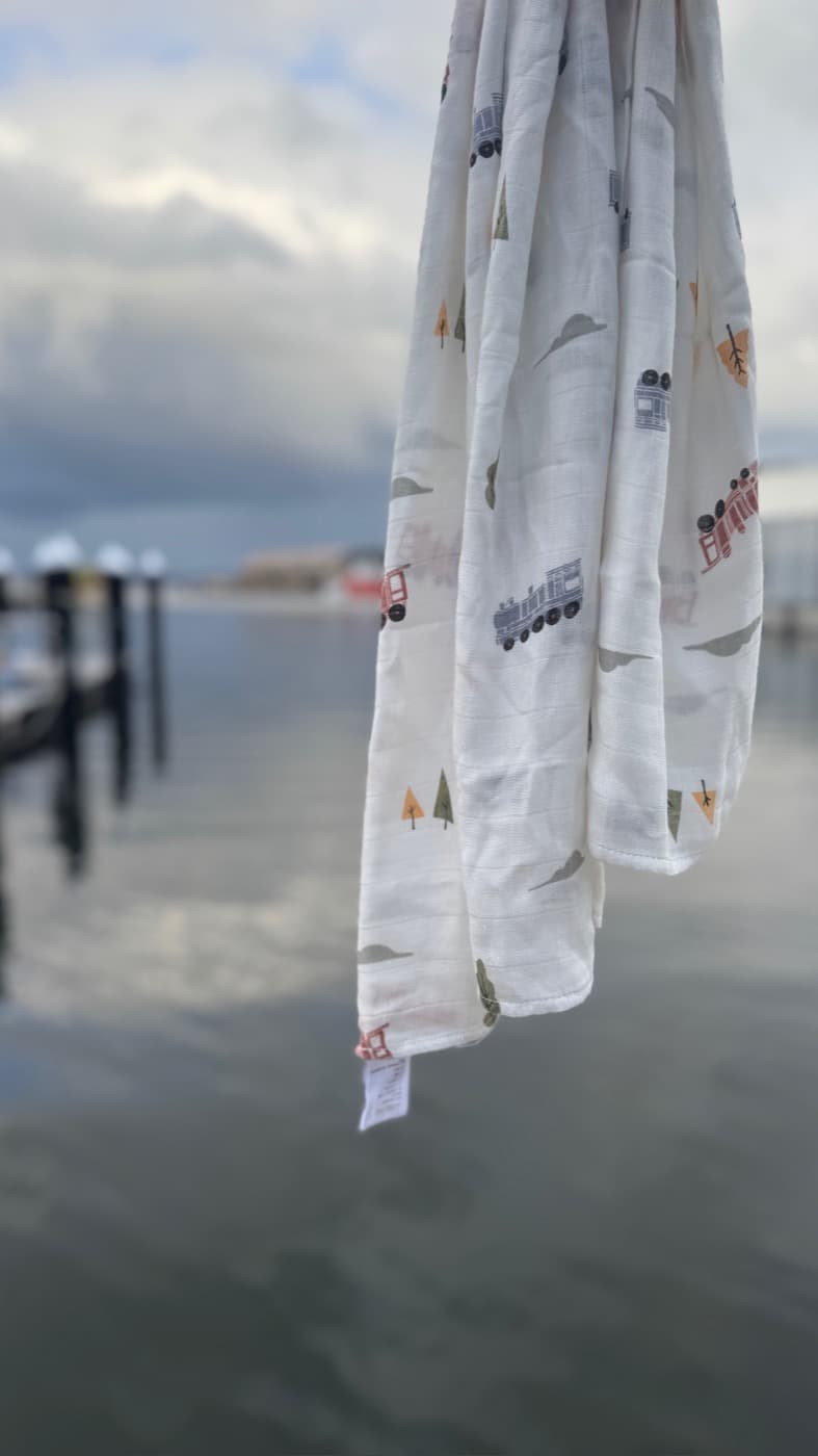 A bamboo muslin hanging in humid, overcast air above open water