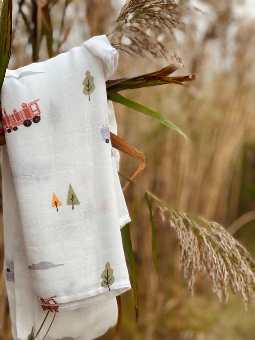 A Little Rei bamboo muslin folded against tall dry autumn grasses and seed heads