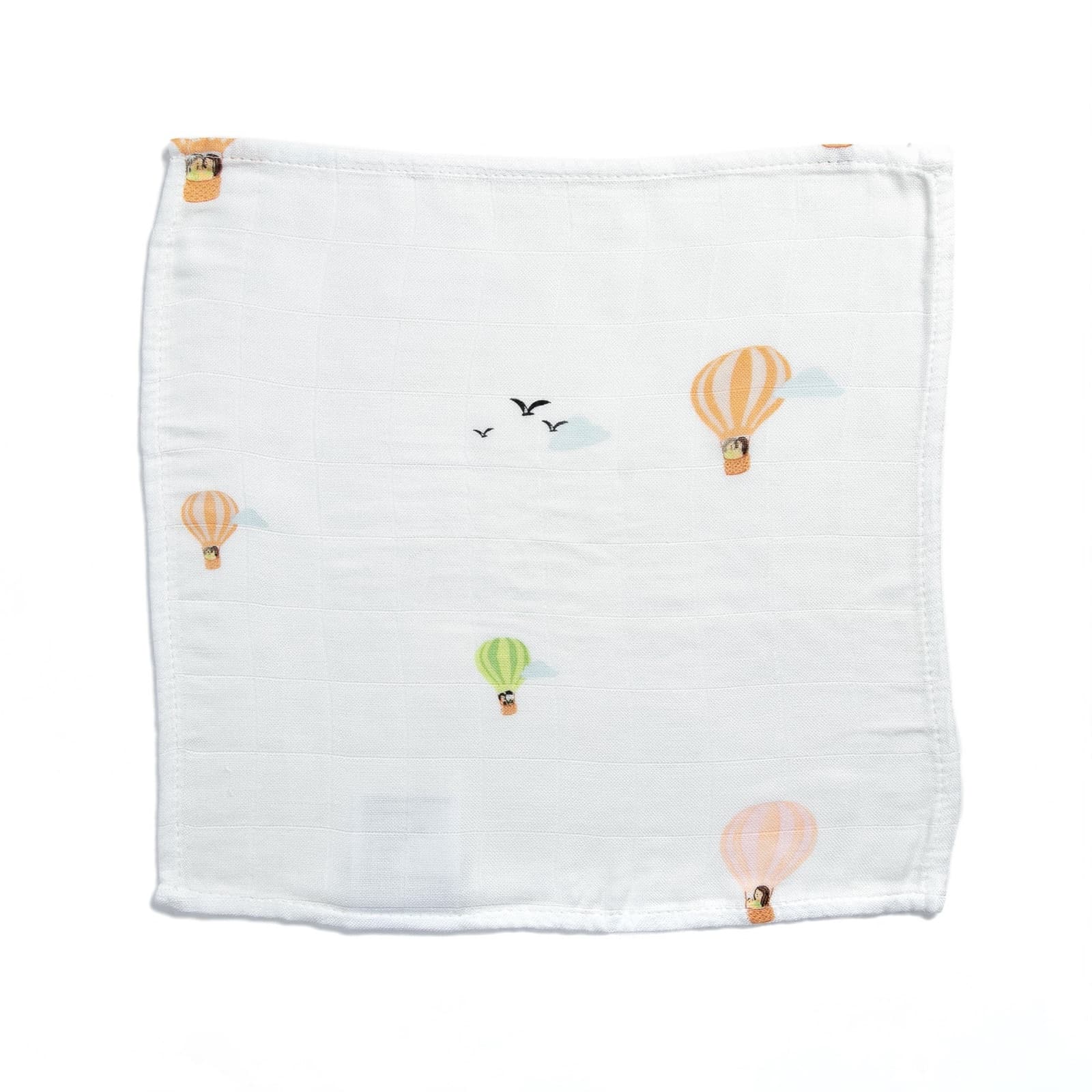 A single bamboo muslin wash cloth printed with pastel hot-air balloons