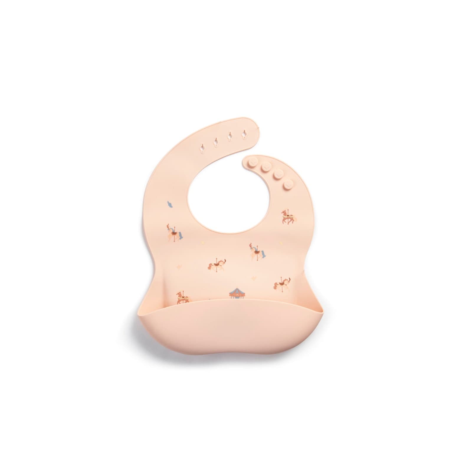 A Little Rei silicone bib in a carousel print with a crumb-catching pocket