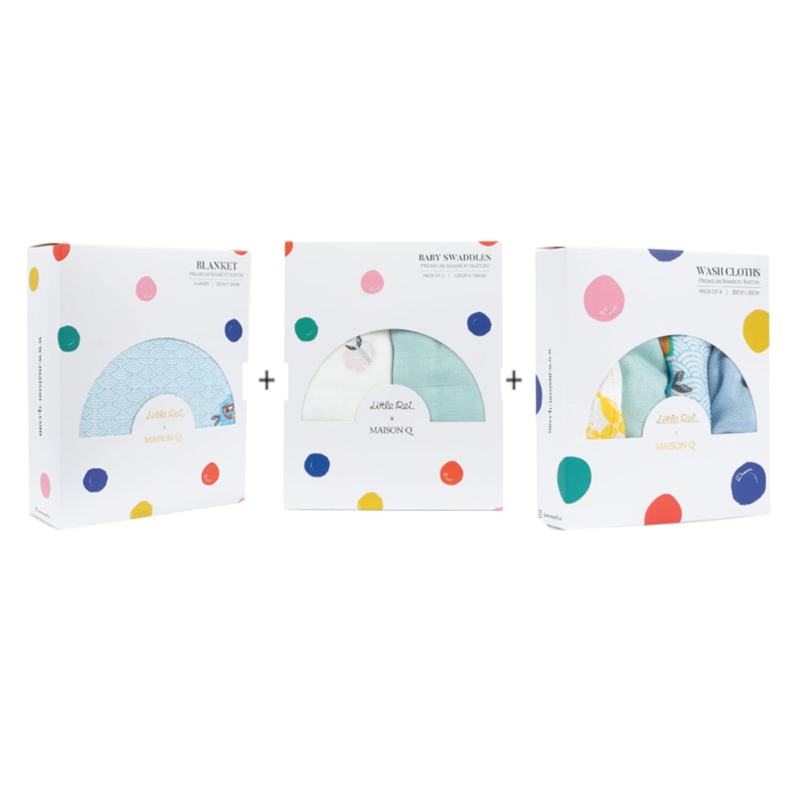 Three Little Rei x Maison Q boxes side by side — a blanket, a swaddle two-pack and a wash cloth four-pack