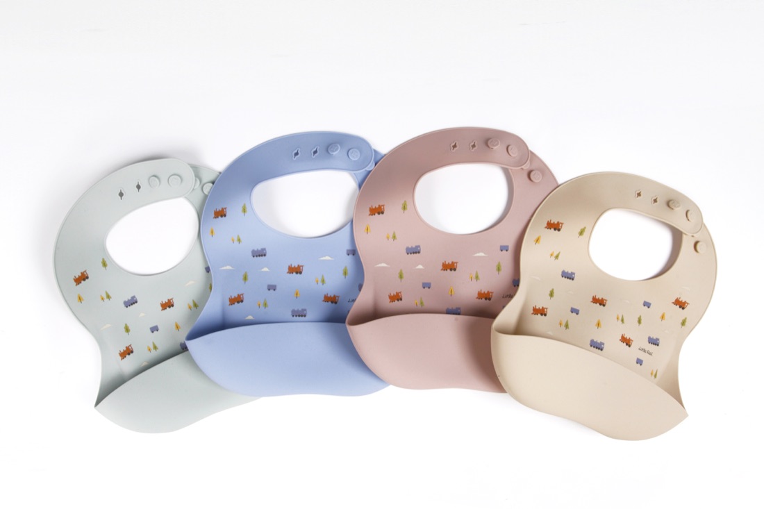 Baby wearing a Little Rei silicone bib