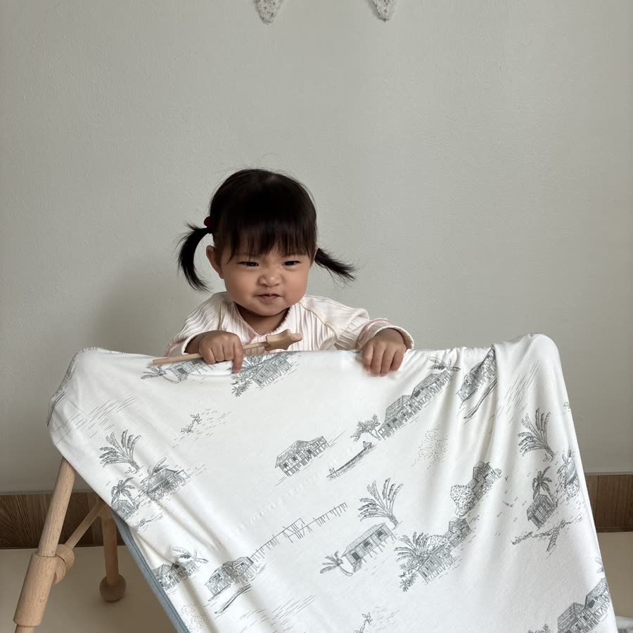 Peekaboo behind a Little Rei blanket